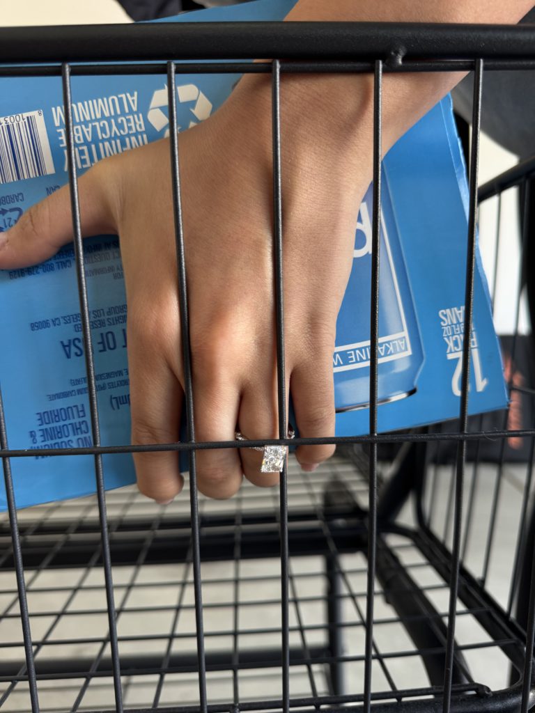 Engagement_ring_caught_grocery_cart Picking up box from a grocery cart while wearing engagment ring